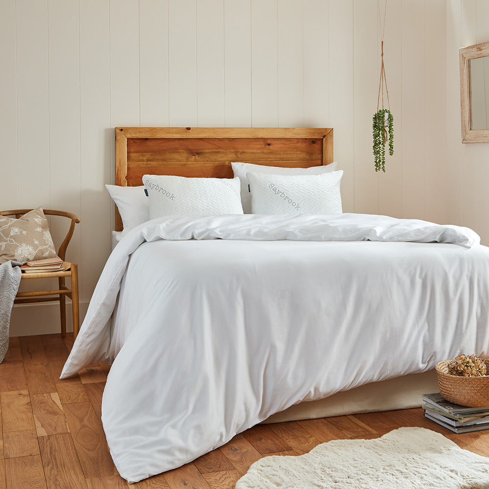 Saybrook pillows on a bed with headboard